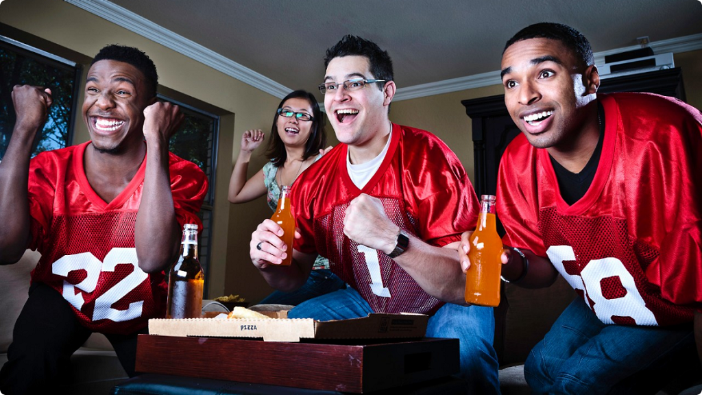 090613-sports-fantasy-football-fans-watching-game-tv-team-men-happy