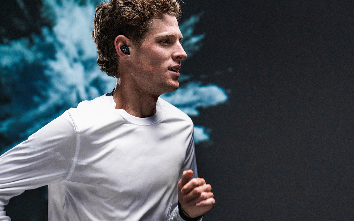 image or runner wearing Jaybird Vista truly wireless headphones