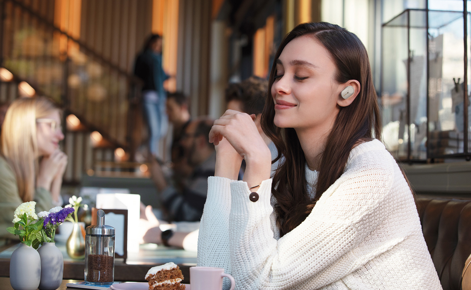 image of woman enjoying silence due to Truly Wireless headphones