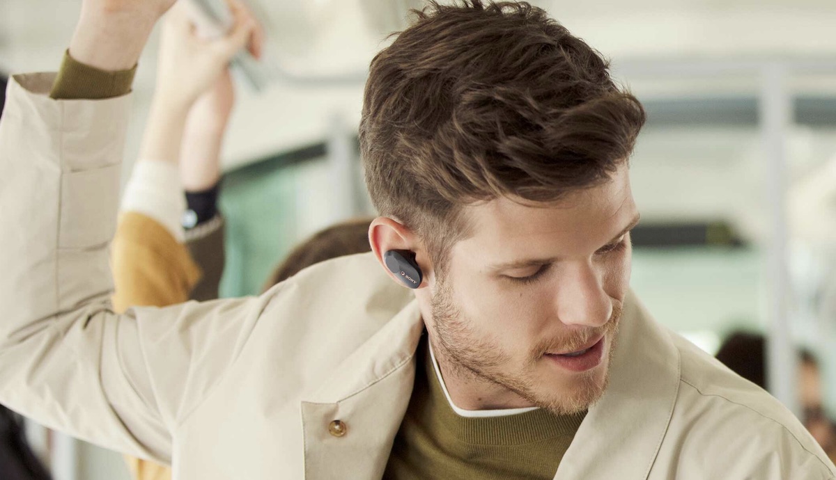 image of men in transport with Sony WF-1000XM3 earbuds