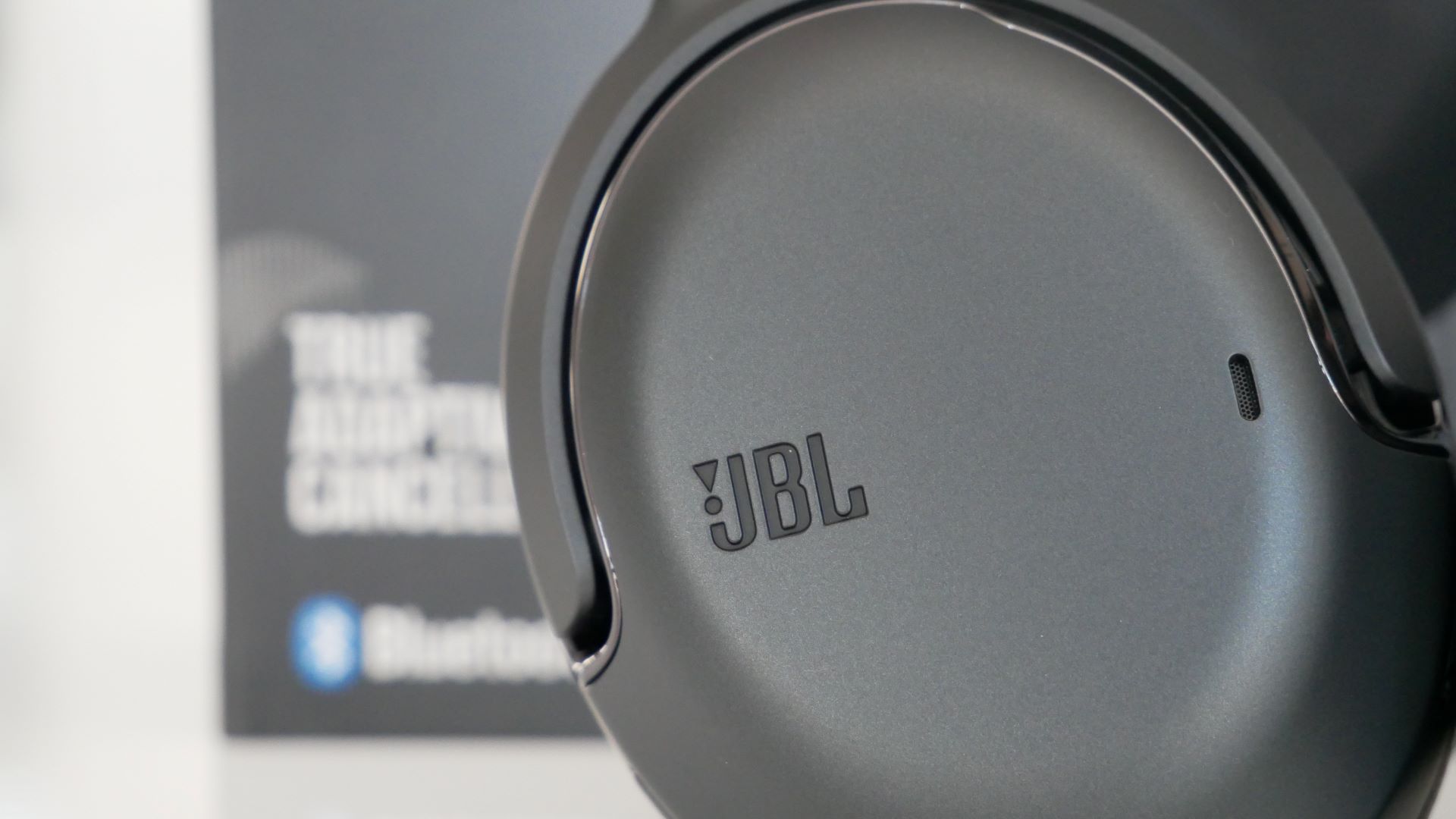 Image of JBL Tour One Headphones on table with box 