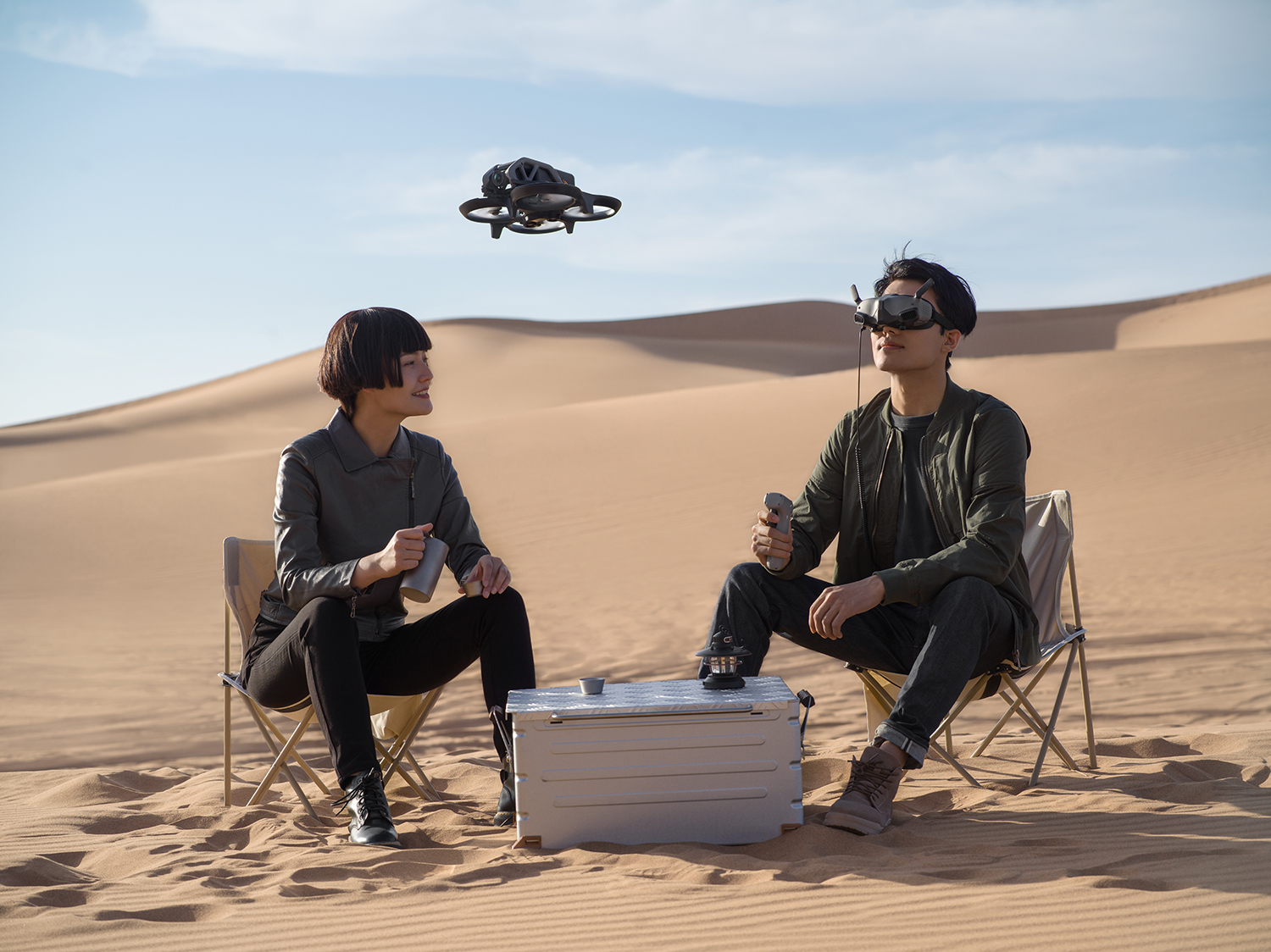 Image of two people use DJI Avata FPV Drone in desert