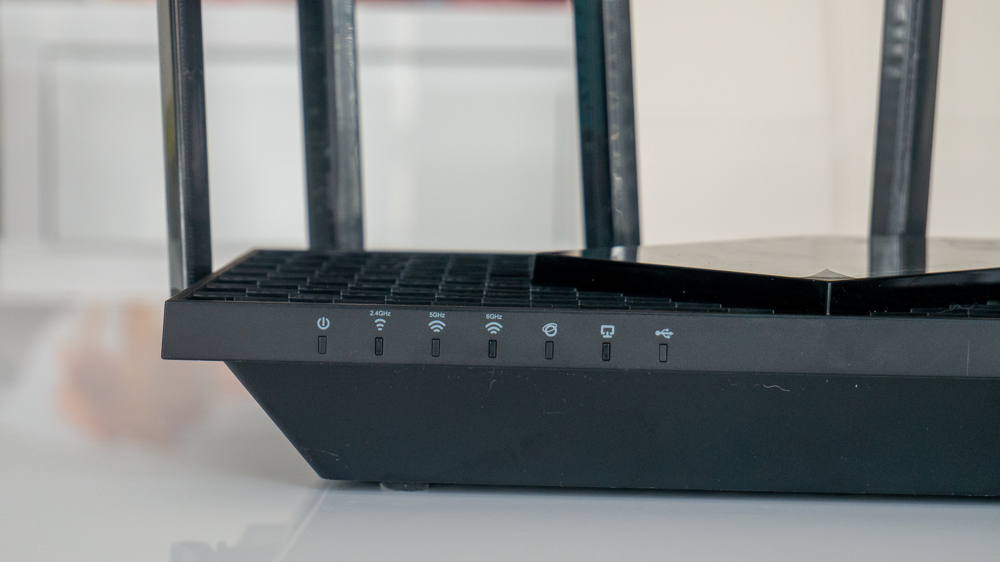 Image of Archer AXE75 router from TP-Link on table 