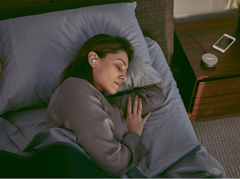 Image of women sleep with earbuds