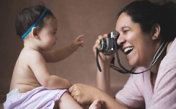 Mum photographing her baby