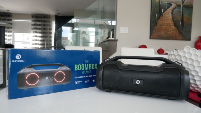 Image of The Boombox speaker by Raycon on table with box