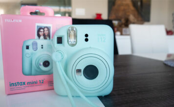 Image of Instax Mini 12 by Fujifilm with box on table