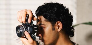Image of a guy with Nikon Z f in a room