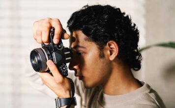 Image of a guy with Nikon Z f in a room