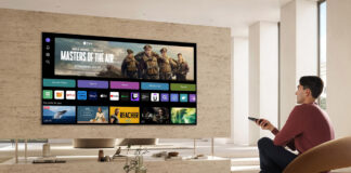 Image of guy using smart tv in saloon