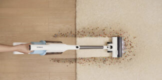An overhead view of the Tineco Go 203 vacuum cleaning a mess on a floor and carpet.