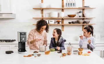 mother and two daughters having fun, making ice cream together with a Ninja ice cream maker.