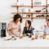 mother and two daughters having fun, making ice cream together with a Ninja ice cream maker.