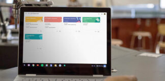 Google Classroom on a Chromebook sitting on a table in a classroom.